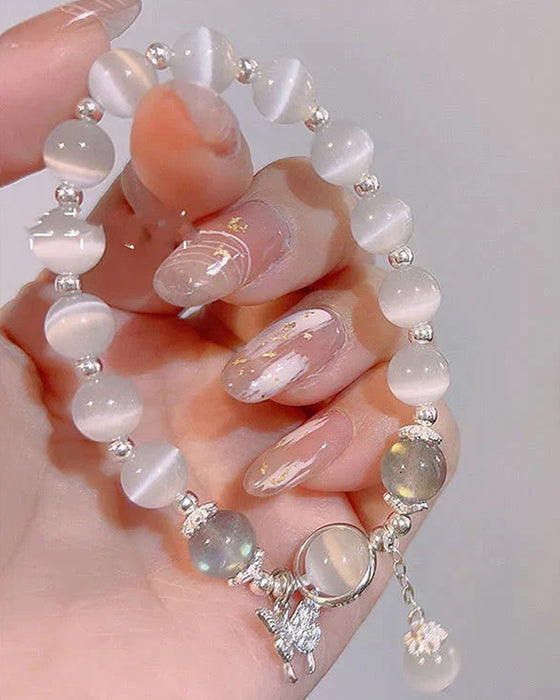 Bracelet imitation œil de chat cristal de papillon