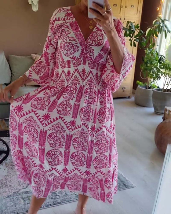 Robe élégante imprimée à col en V et manches cloche plissées