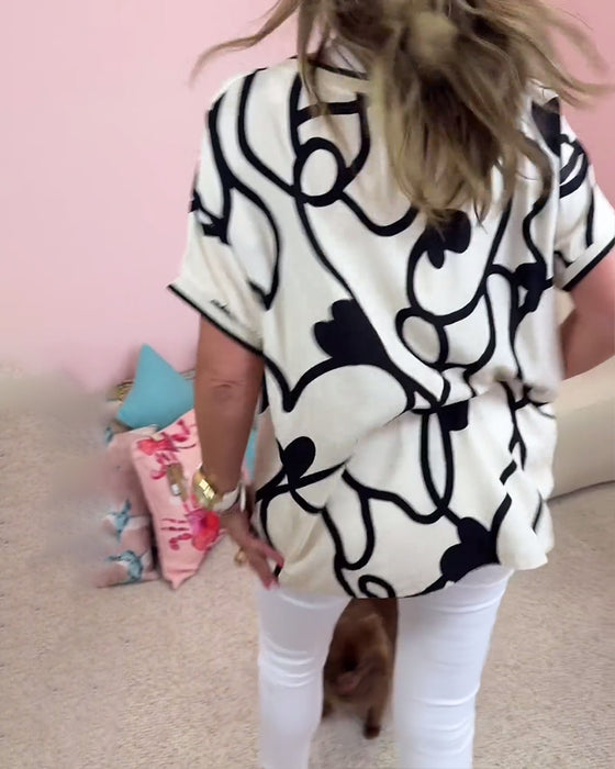 Haut décontracté à manches courtes et col en V imprimé contrasté