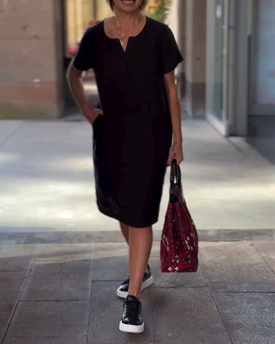 Robe de poche à manches courtes et col en V de couleur unie