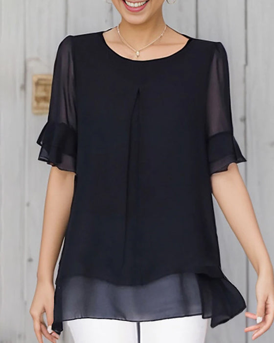 Haut uni à col rond et manches à volants