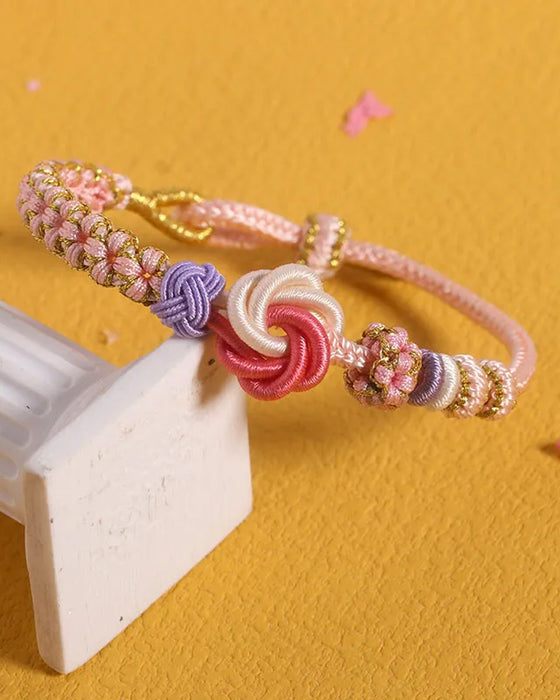 Bracelet avec noeud de fleurs de pêcher