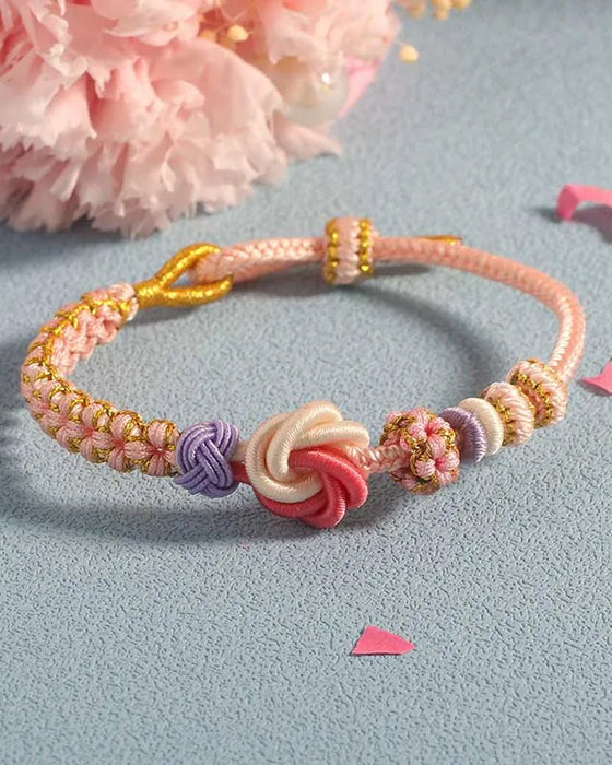 Bracelet avec noeud de fleurs de pêcher