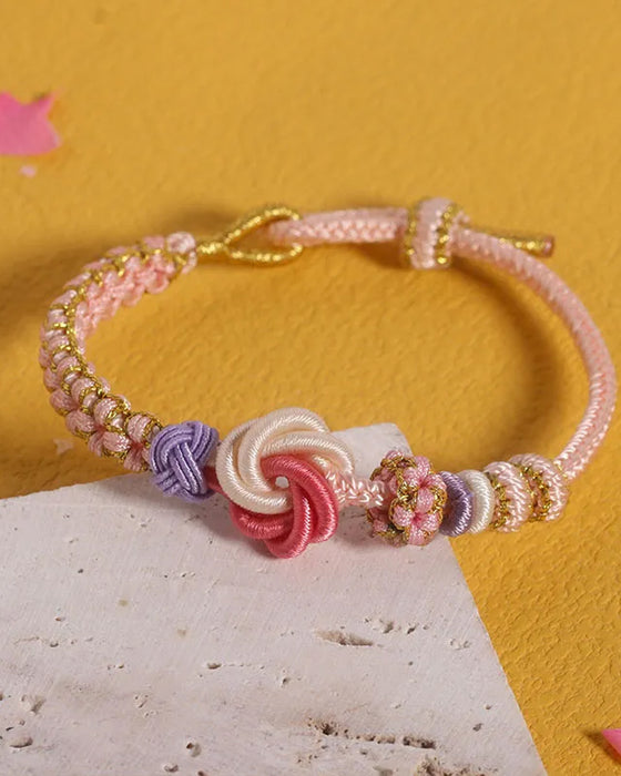 Bracelet avec noeud de fleurs de pêcher
