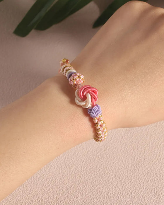 Bracelet avec noeud de fleurs de pêcher