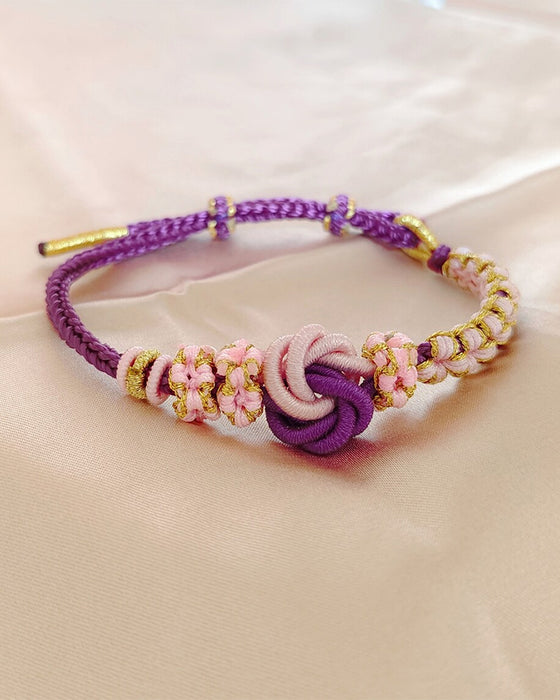Bracelet avec noeud de fleurs de pêcher