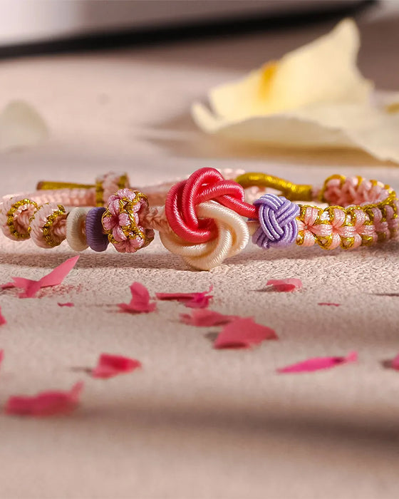 Bracelet avec noeud de fleurs de pêcher