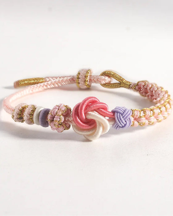 Bracelet avec noeud de fleurs de pêcher