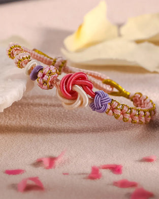 Bracelet avec noeud de fleurs de pêcher