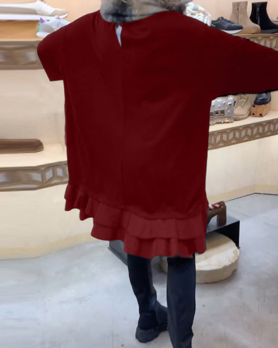 Robe à la silhouette élégante et aux manches longues