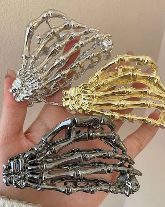 Pince à cheveux en forme de griffe de squelette