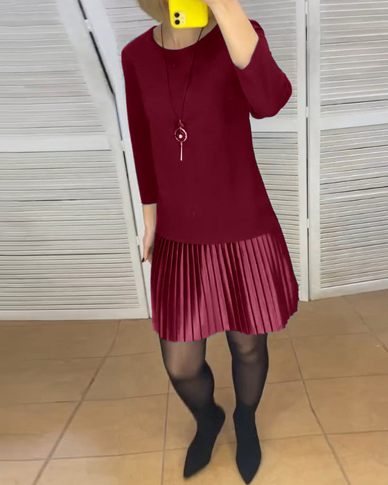 Robe à pans plissés et couleurs unies