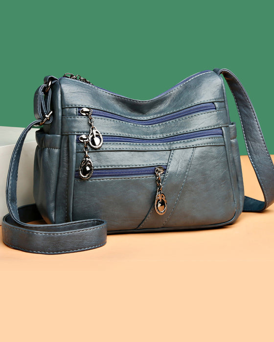 Sac bandoulière en cuir souple avec multipoches