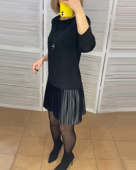 Robe à pans plissés et couleurs unies