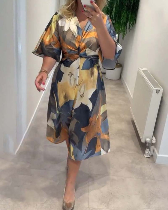 Robe élégante à col en V torsadé à imprimé floral