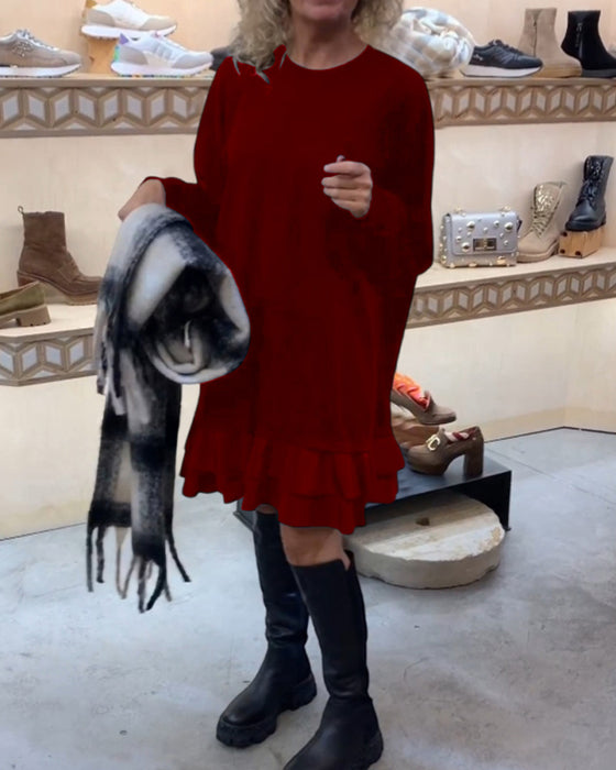 Robe à la silhouette élégante et aux manches longues