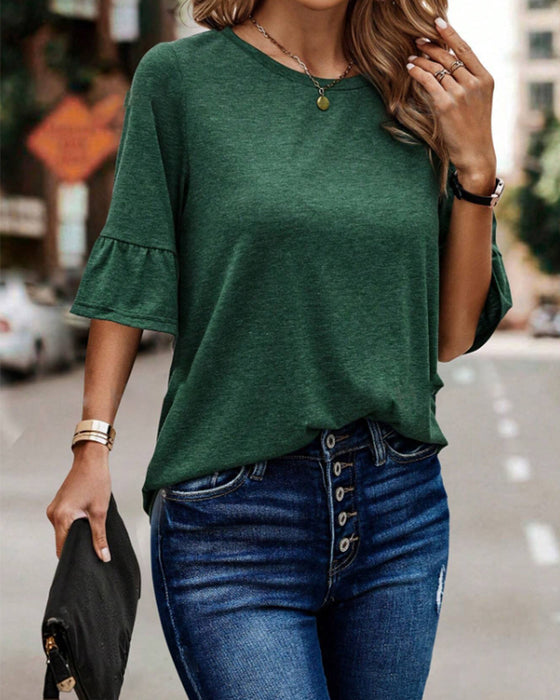 Haut élégant boutonné au dos de couleur unie