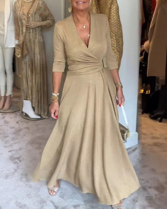 Robe élégante de couleur unie avec col en V et manches trois-quarts
