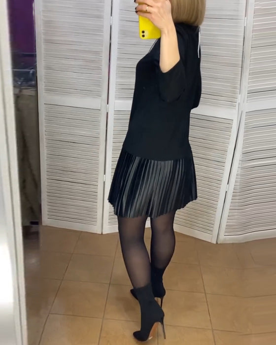 Robe à pans plissés et couleurs unies