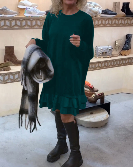 Robe à la silhouette élégante et aux manches longues