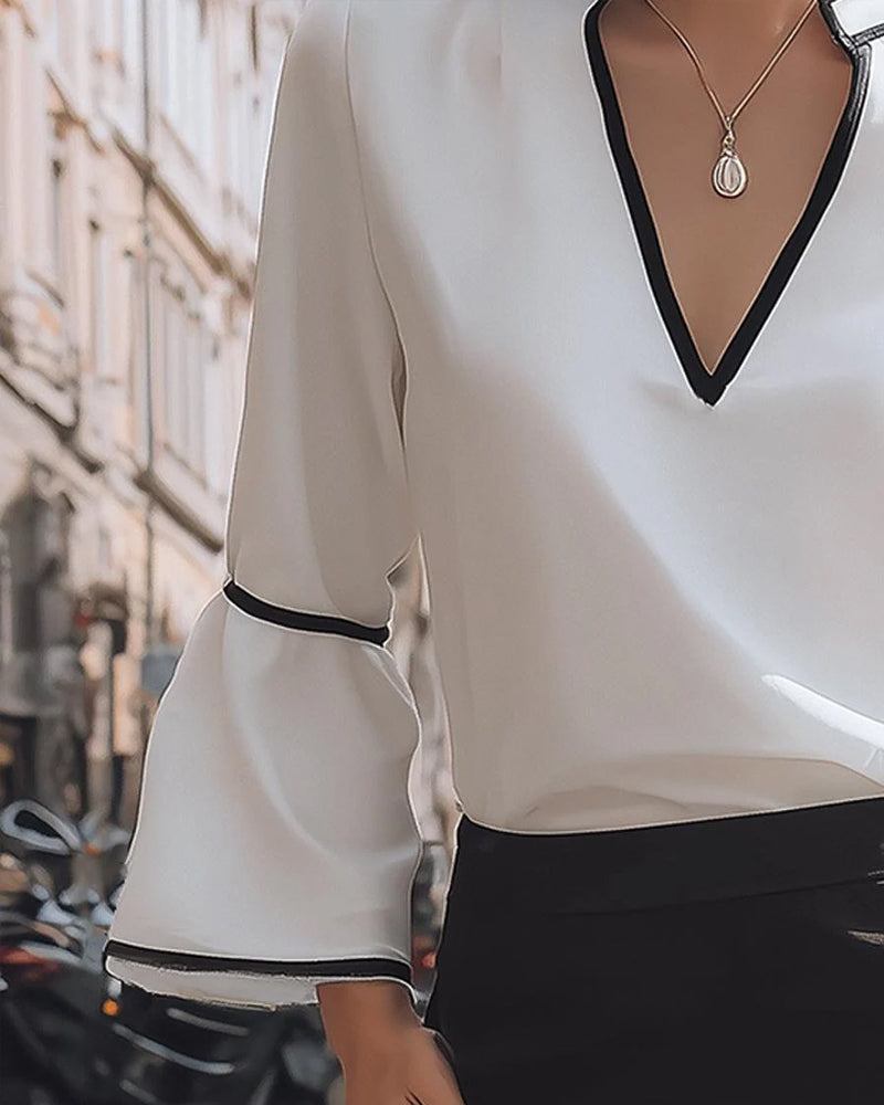 Blouse élégante à col en V couleur unie
