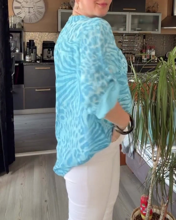 Blouse imprimée col V poche boutonnée manches trois-quarts