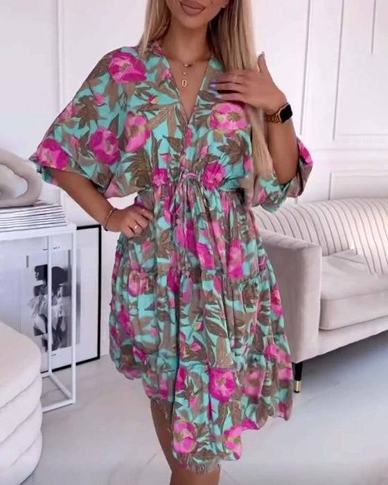 Robe élégante avec cordons de serrage et imprimé floral