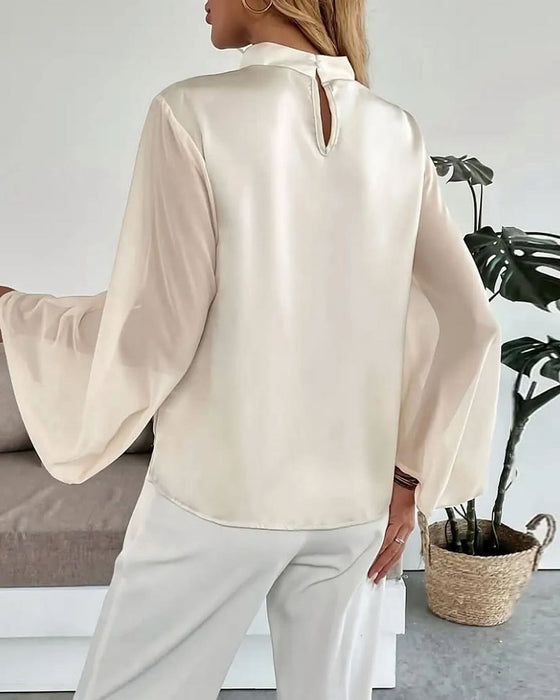 Blouse élégante unie à col montant