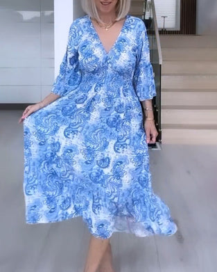 Robe fluide imprimée ceinturée col V