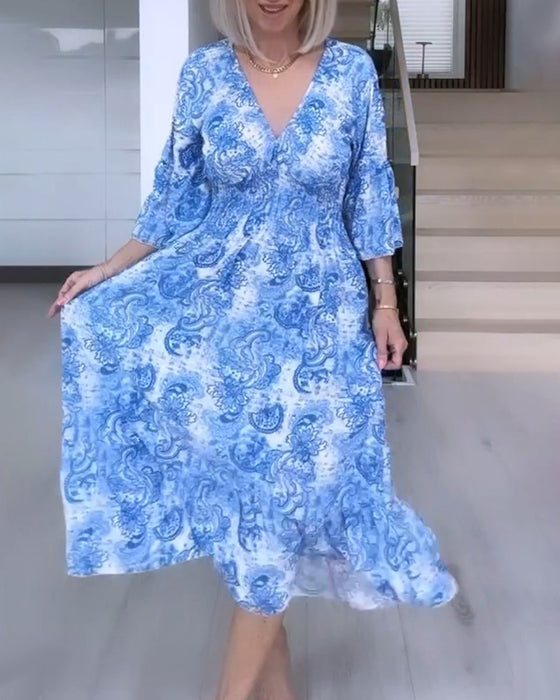 Robe fluide imprimée ceinturée col V