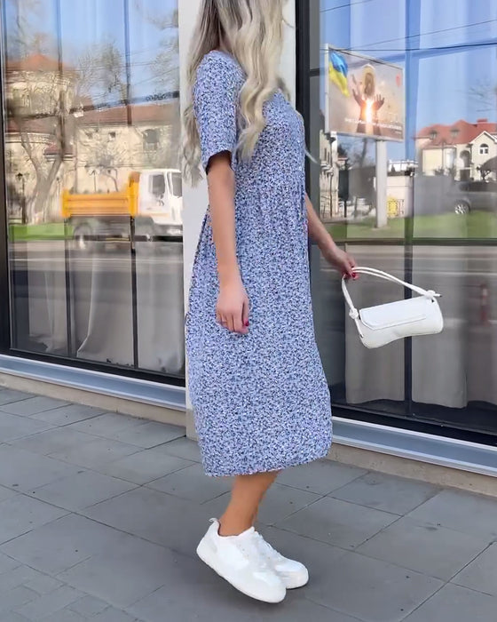 Robe fleurie boutonnée à manches mi-longues