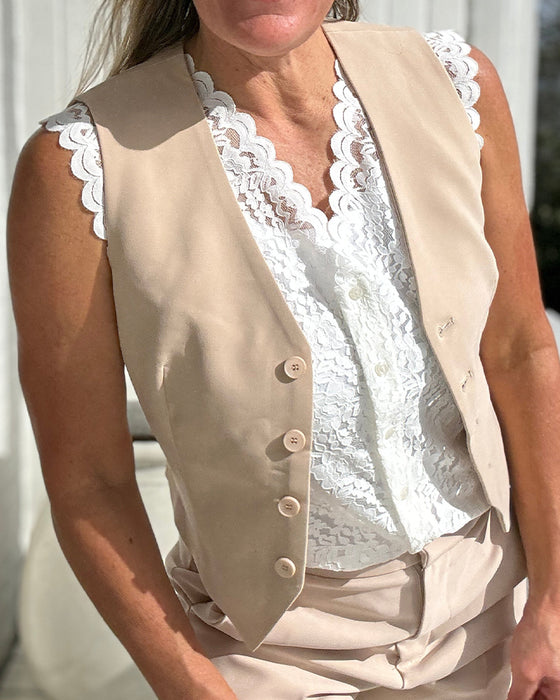 Débardeur élégant sans manches en dentelle avec col en V