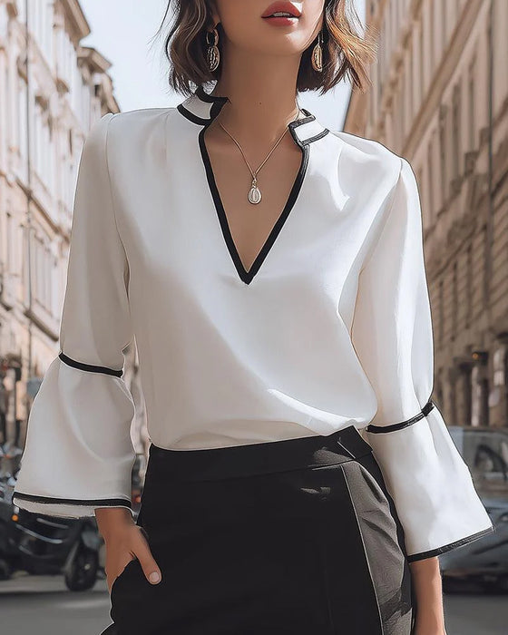 Blouse élégante à col en V couleur unie