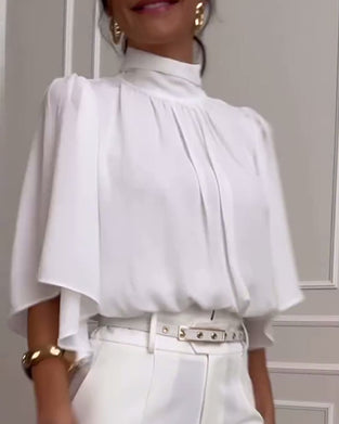 Blouse à manches papillon et col haut de couleur unie