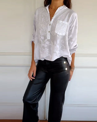 Haut élégant de couleur unie avec poche boutonnée