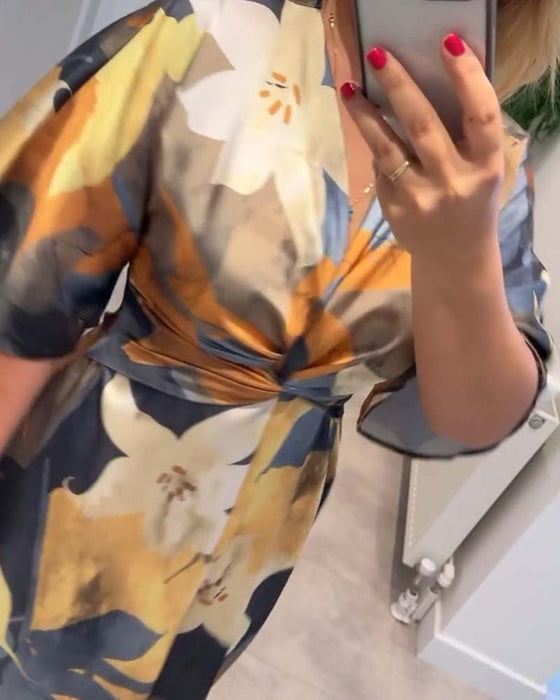 Robe élégante à col en V torsadé à imprimé floral