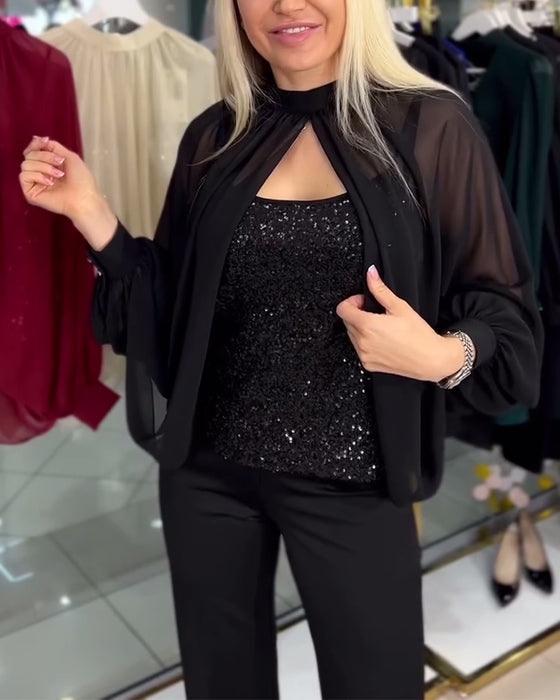 Chemisier à paillettes et manches chauve-souris