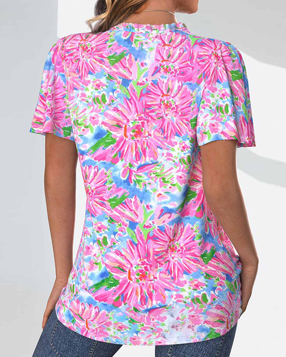 Blouse à manches courtes et fleurie et boutons