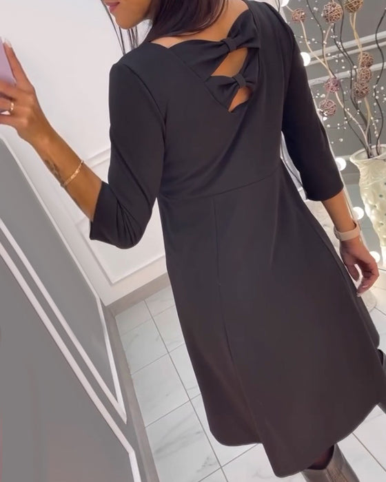 Robe unie avec nœud au dos