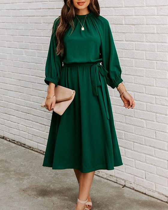 Robe élégante de couleur unie à col rond