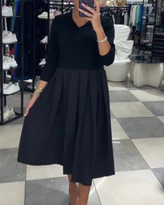 Robe plissée à empiècements et col en V