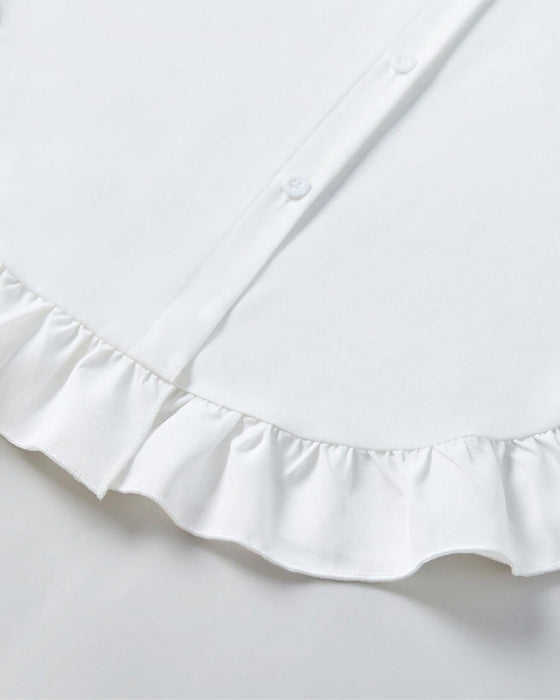 Chemise unie à volants et revers